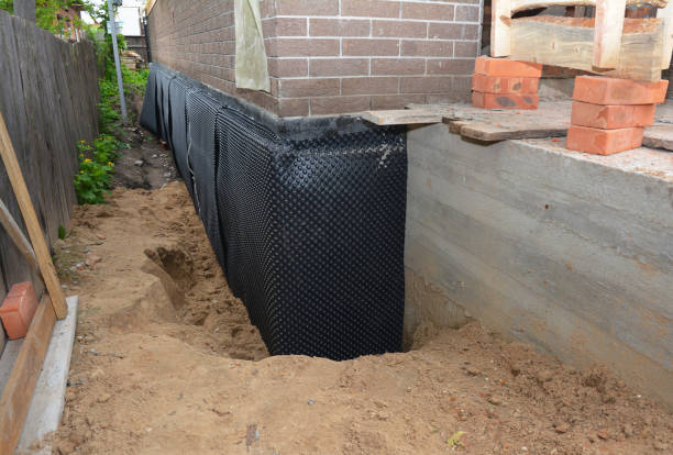SJ Waterproofing Pros technician performing targeted Waterproofing assessment in Smiths Station, AL